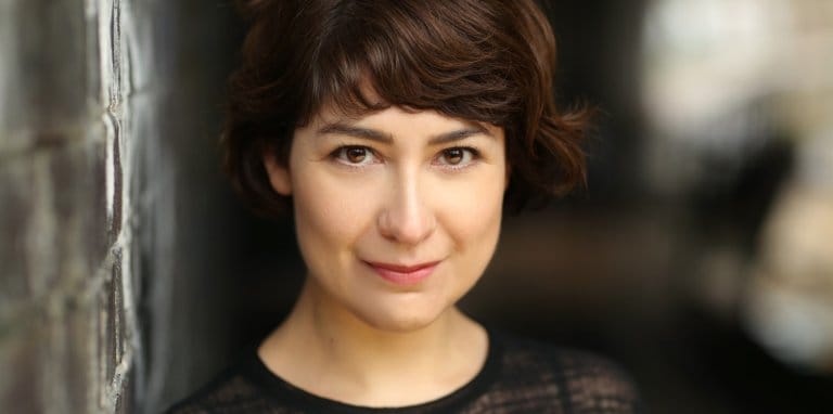 Jennifer Jackson headshot, face-on to camera. Jennifer is a Latinx Anglo-Bolivian woman with short brown hair and brown eyes.