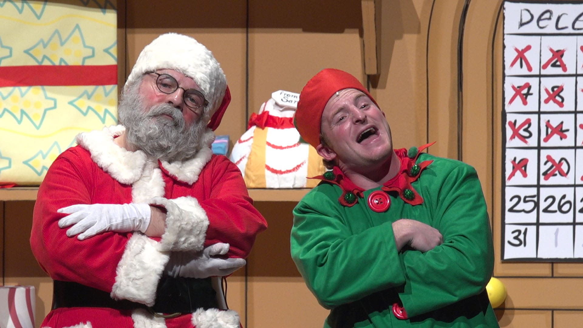 Santa and an elf sing a song