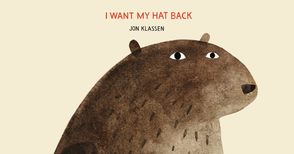 An illustration from the front cover of Jon Klassen's I Want My Hat Back, showing a large bear with a serious expression