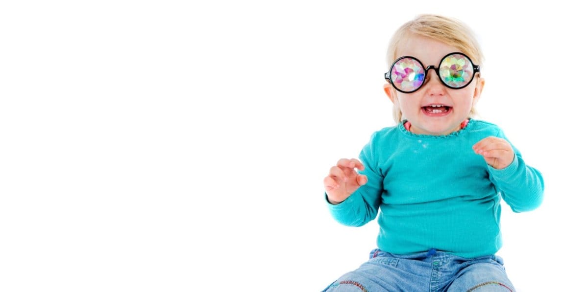 A baby wears glasses with Kaleidoscope lenses