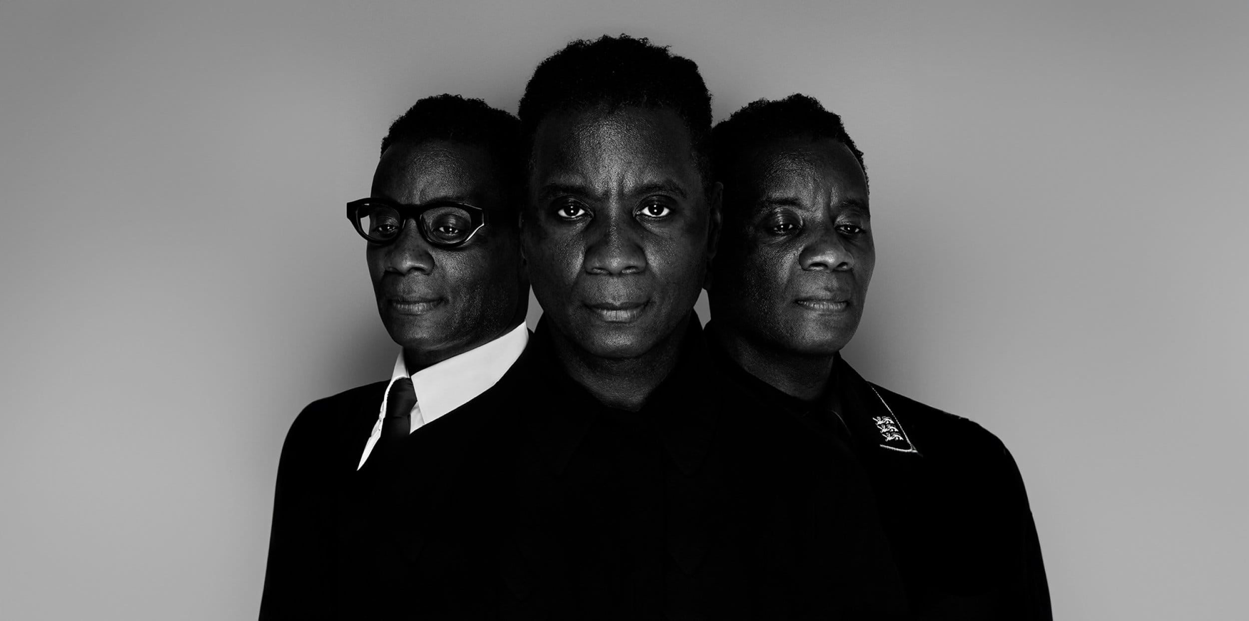 3 men each wearing a different suit dramatically look forward.