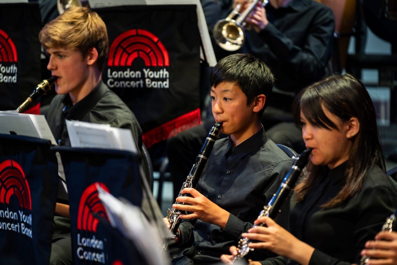 Close up photograph of London Youth Concert band members in the clarinet section.