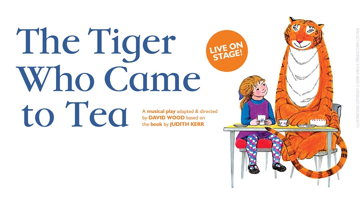 An illustration from the Book The Tiger Who Came to Tea showing Sophie, a small girl dressed in a purple dress, sat at a table with an enormous tiger who is smiling down at her.