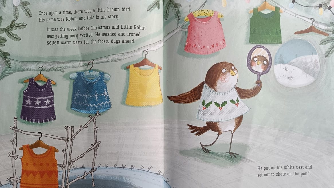 A spread from Jan Fearnley's book, Little Robin Red Vest, showing an illustration of the robin wearing a knitted vest and a washing line on which several more vests are handing.