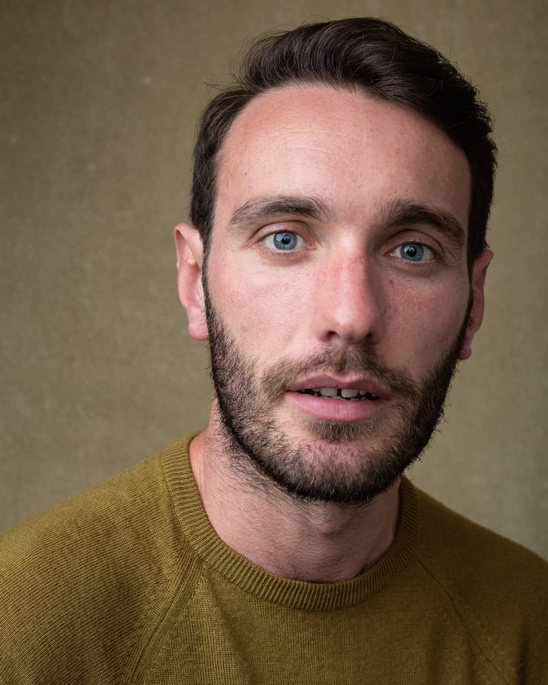 Head shot of Joseph Clowser. A white man with dark short hair and stubble.