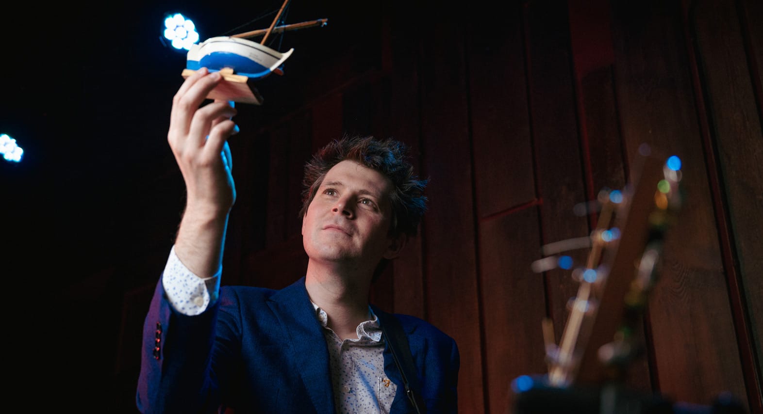 David Gibb holds a toy sailboat.