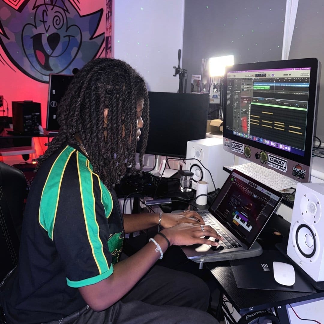 An image of a young person in a music studio